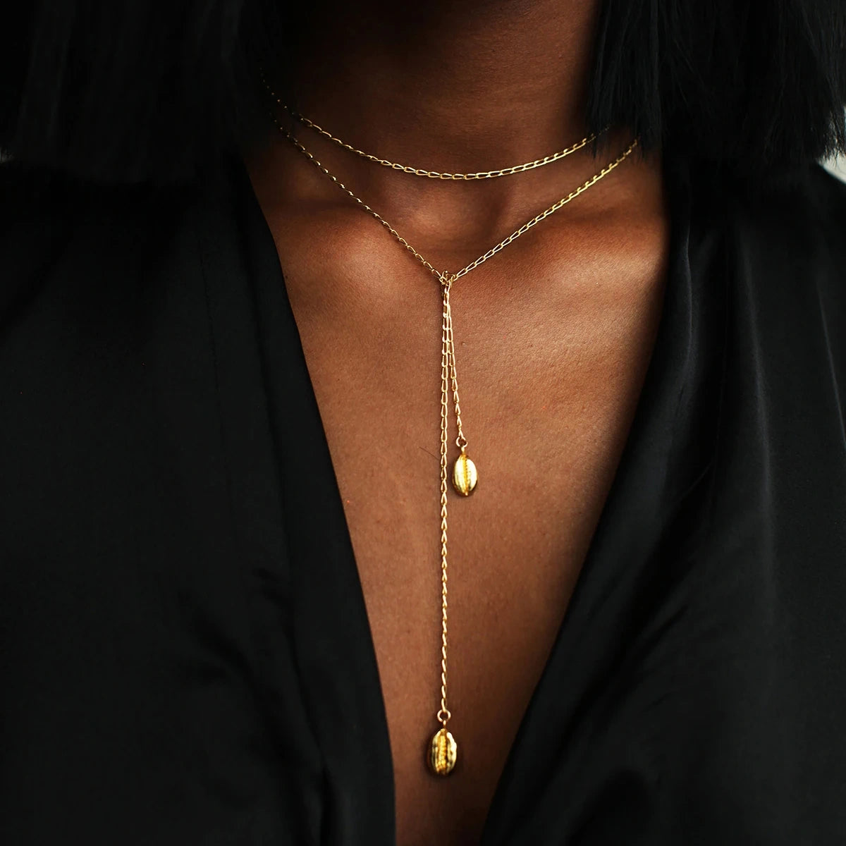 image of cowrie necklace on african lady.