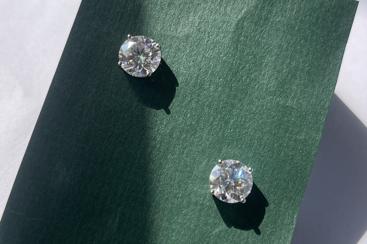 ITURA lab-grown moissanite studs on green