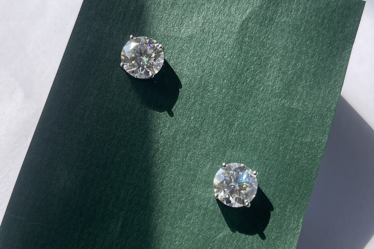 ITURA lab-grown moissanite studs on green